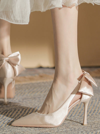 back ribbon pointed toe pumps